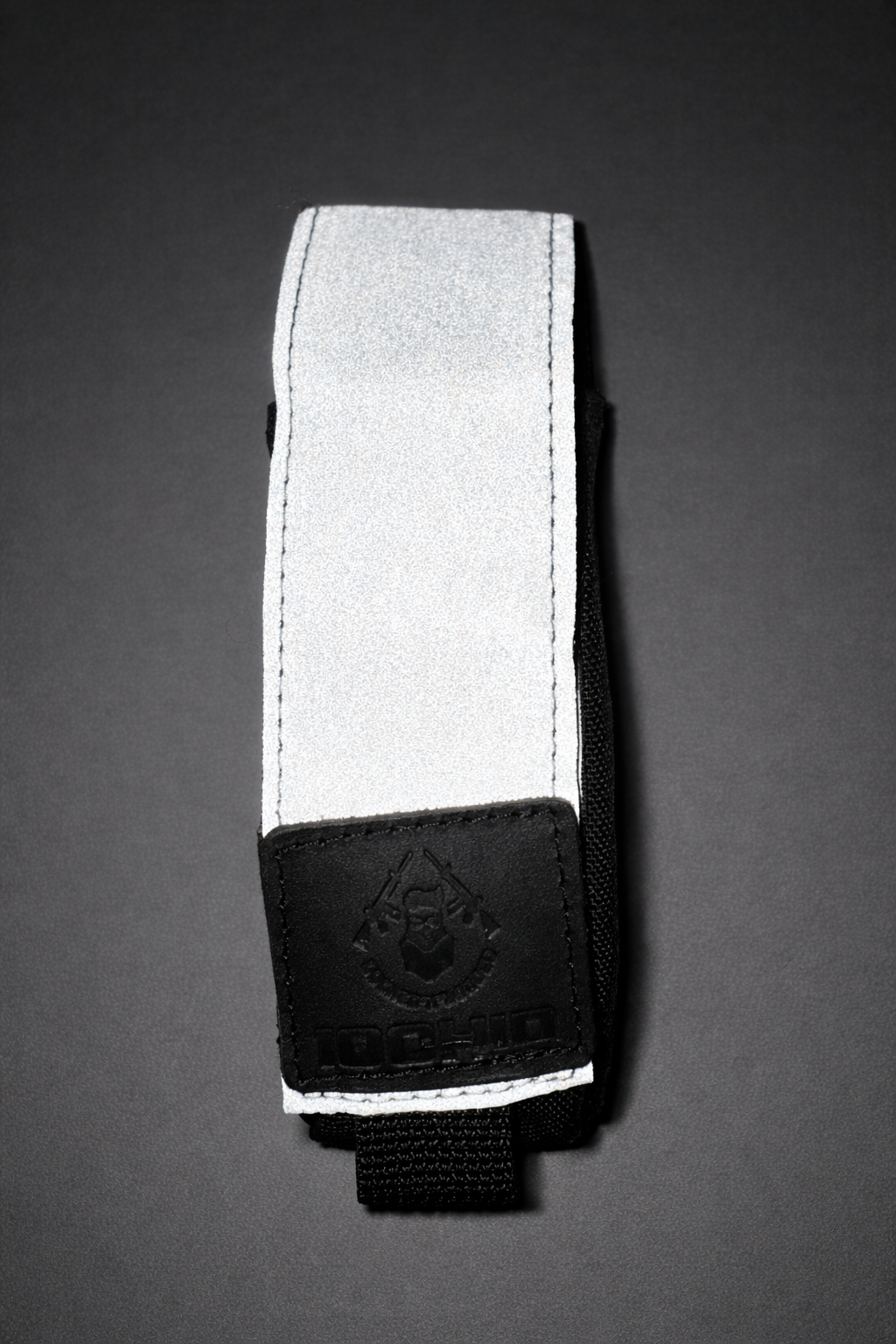 Šviesą atspindintis turniketo dėklas